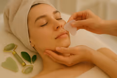 Woman having Gua Sha facial Massage
